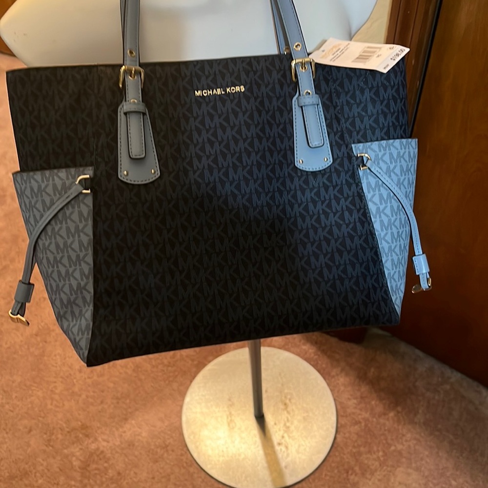 New MK hand bag 14 by 12 never used clean inside and out beautiful bag